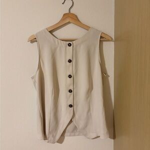 Elegant Cream Sleeveless Top with Turtoiseshell Buttons